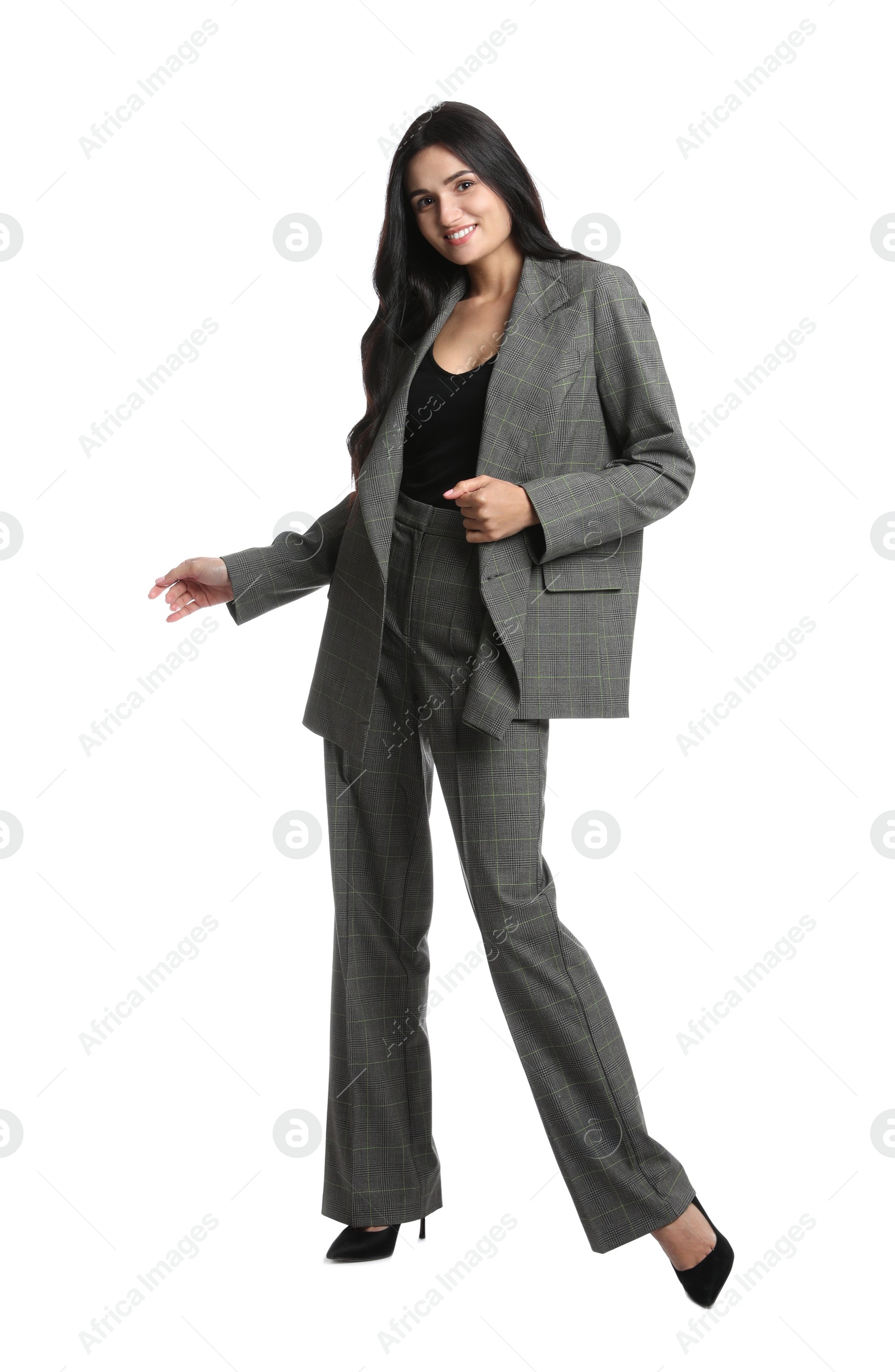 Photo of Full length portrait of beautiful woman in formal suit on white background. Business attire