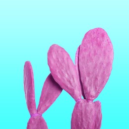 Image of Pink cactus on turquoise background. Creative design