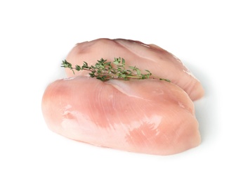 Photo of Raw chicken breasts with thyme on white background. Fresh meat
