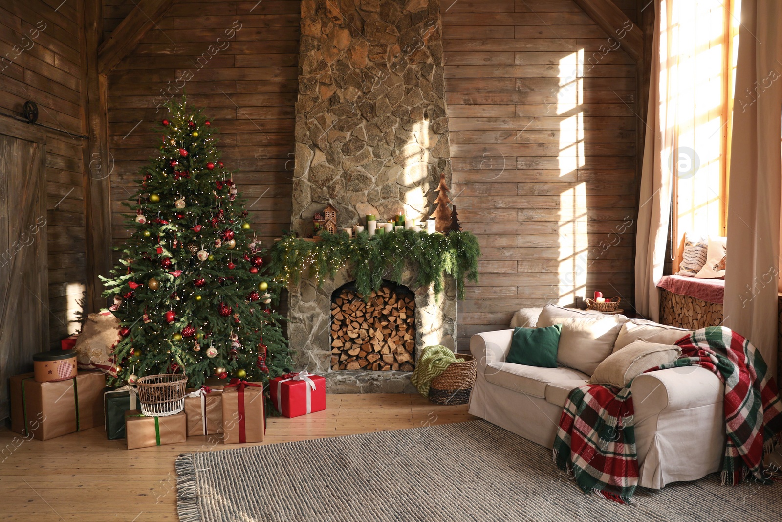 Photo of Festive interior with decorated Christmas tree and fireplace