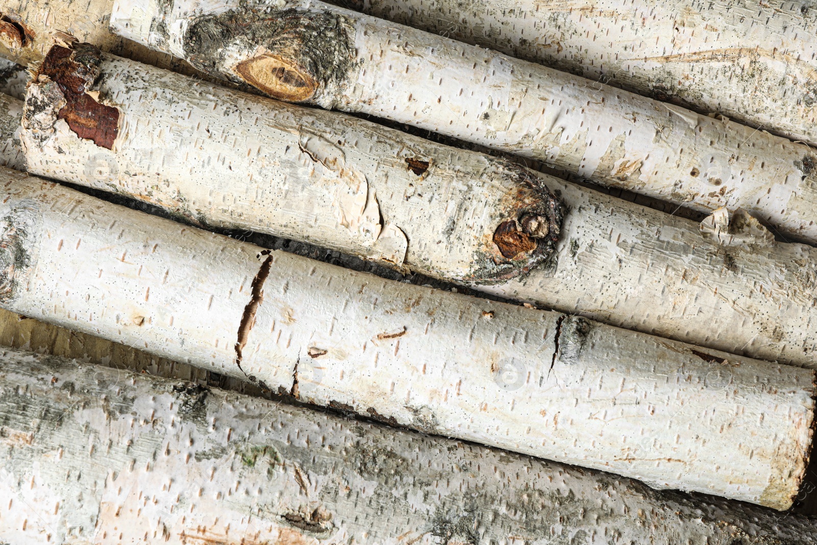 Photo of Cut firewood as background, top view. Heating in winter