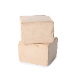 Blocks of compressed yeast on white background