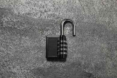 One steel combination padlock on grey table, top view