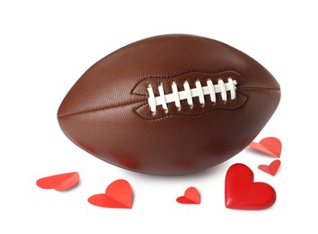 American football ball and hearts on white background