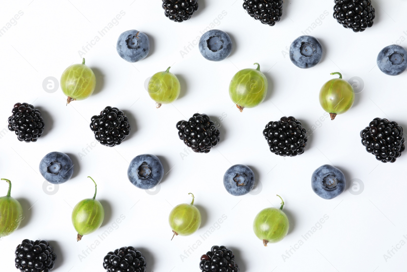 Photo of Composition with gooseberries, blackberries and blueberries on white background