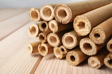 Pile of dry bamboo sticks on wooden table