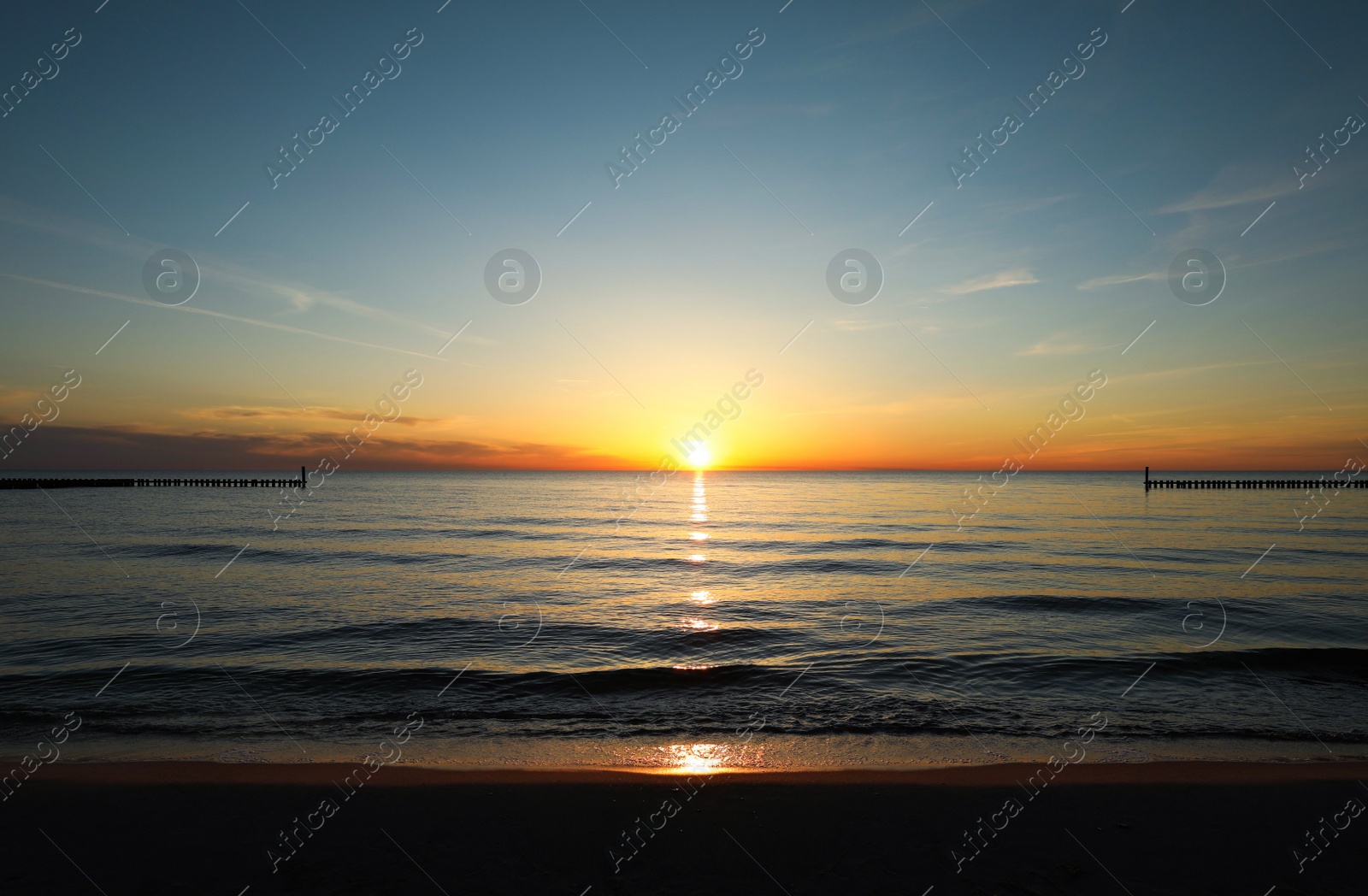 Picturesque view of beautiful sea beach at sunset Photo of Picturesque view of beautiful sea beach at sunset