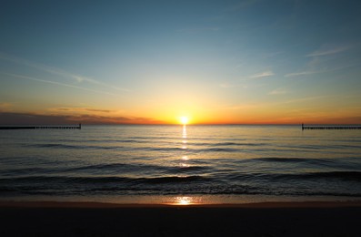 Photo of Picturesque view of beautiful sea beach at sunset