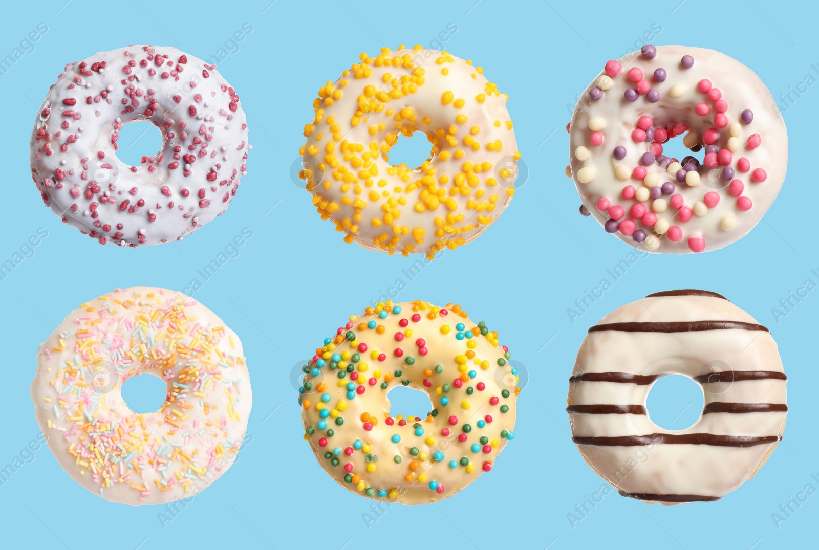 Image of Set with delicious glazed donuts on light blue background