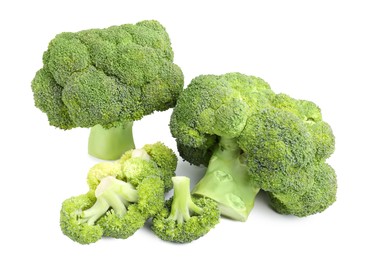 Photo of Pile of fresh raw green broccoli isolated on white