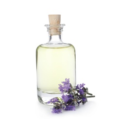 Photo of Bottle with natural lavender oil and flowers on white background