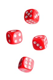 Four red dice in air on white background