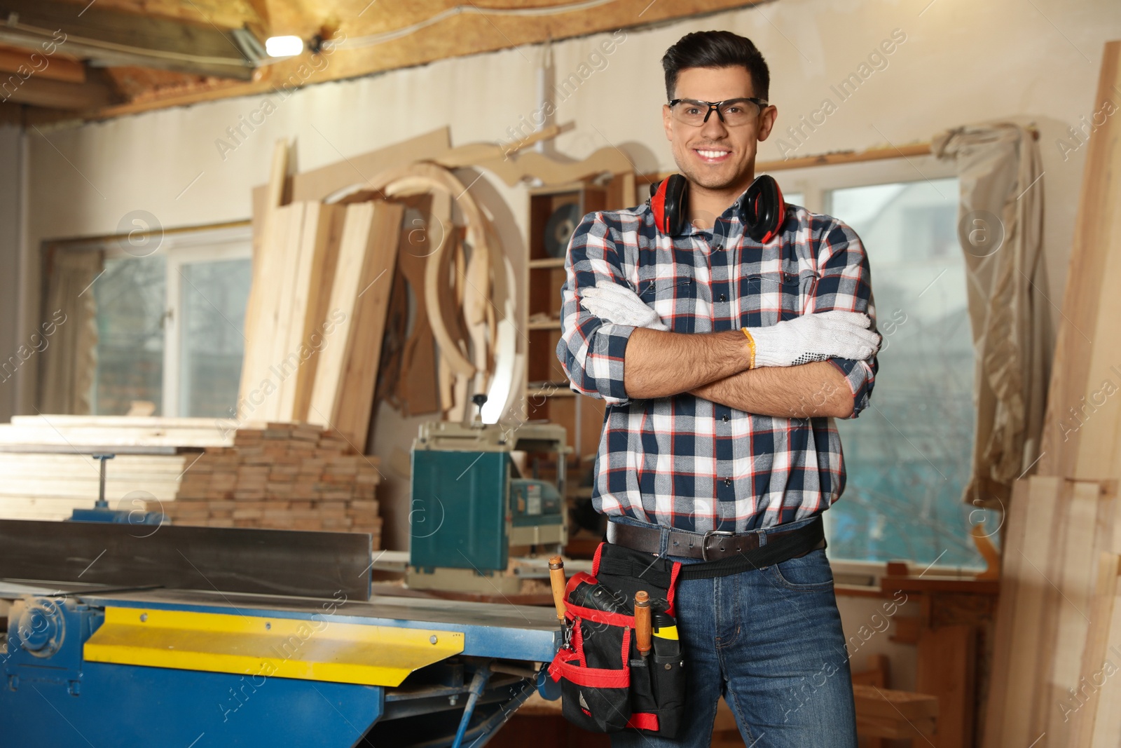 Photo of Professional carpenter with set of tools in workshop