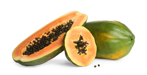 Fresh juicy ripe papayas on white background