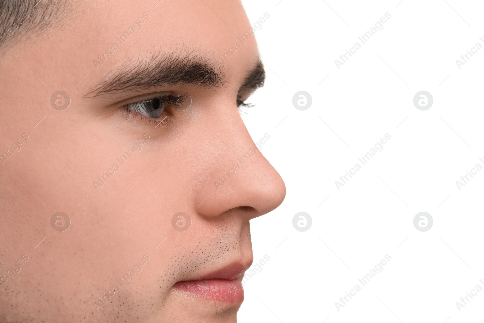 Photo of Portrait of young man on white background, closeup