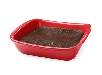 Delicious chocolate brownie in baking dish on white background