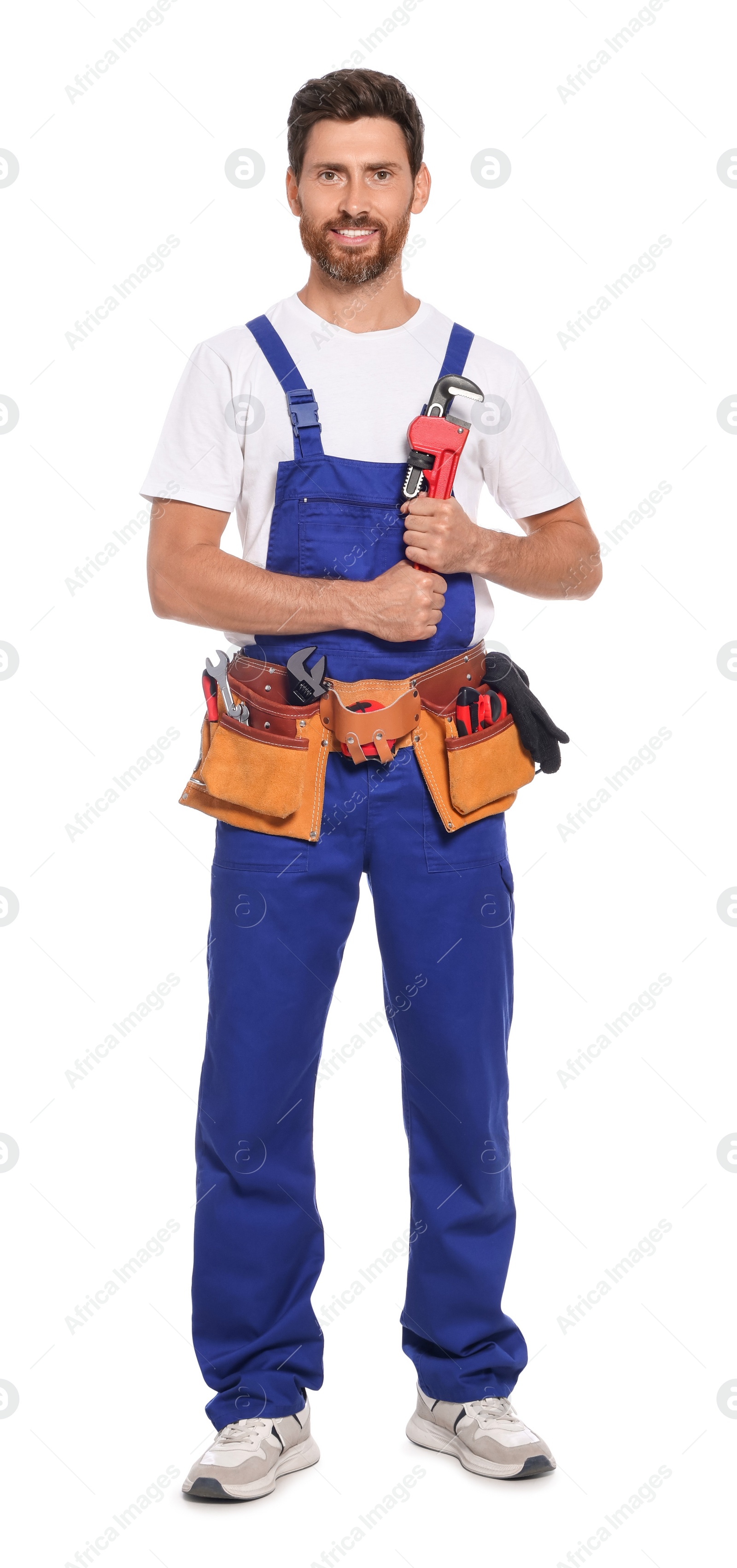 Photo of Professional plumber with pipe wrench and tool belt on white background