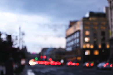 Photo of Blurred view of modern city at evening. Bokeh effect