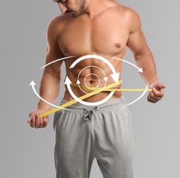 Image of Metabolism concept. Man with perfect body on light grey background