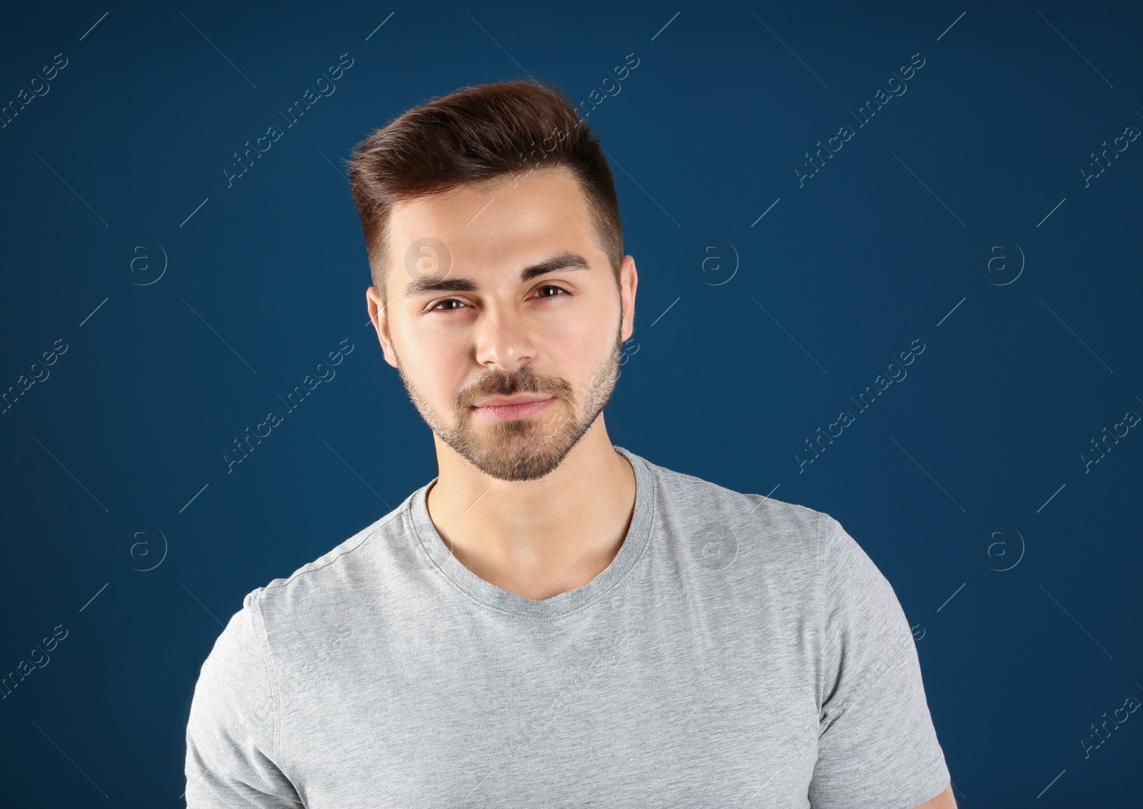 Photo of Portrait of handsome man on color background