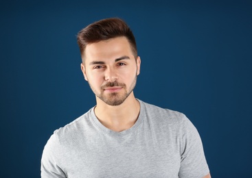 Photo of Portrait of handsome man on color background