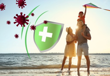 Image of Happy parents and their child on beach near sea. Strong immunity - shield against viruses