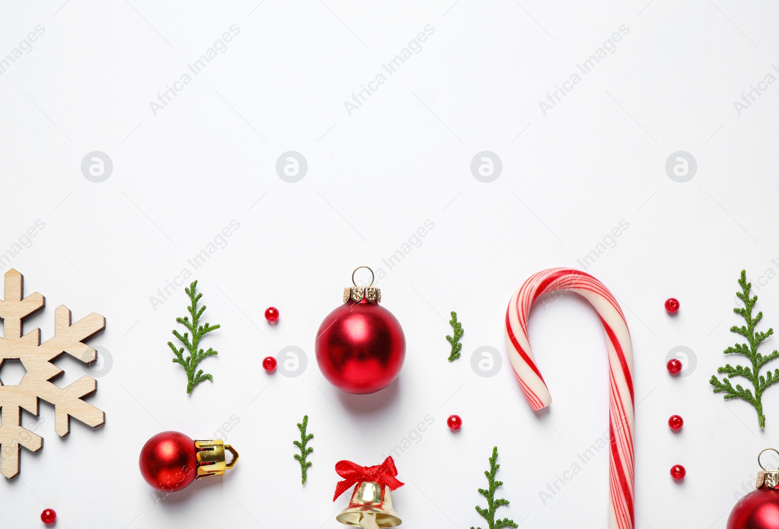 Photo of Flat lay composition with Christmas decor on white background. Space for text