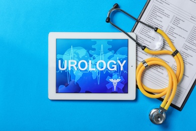 Photo of Flat lay composition with tablet, stethoscope and test form on color background. Urology concept