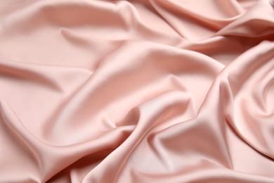 Photo of Texture of delicate pink silk as background, closeup