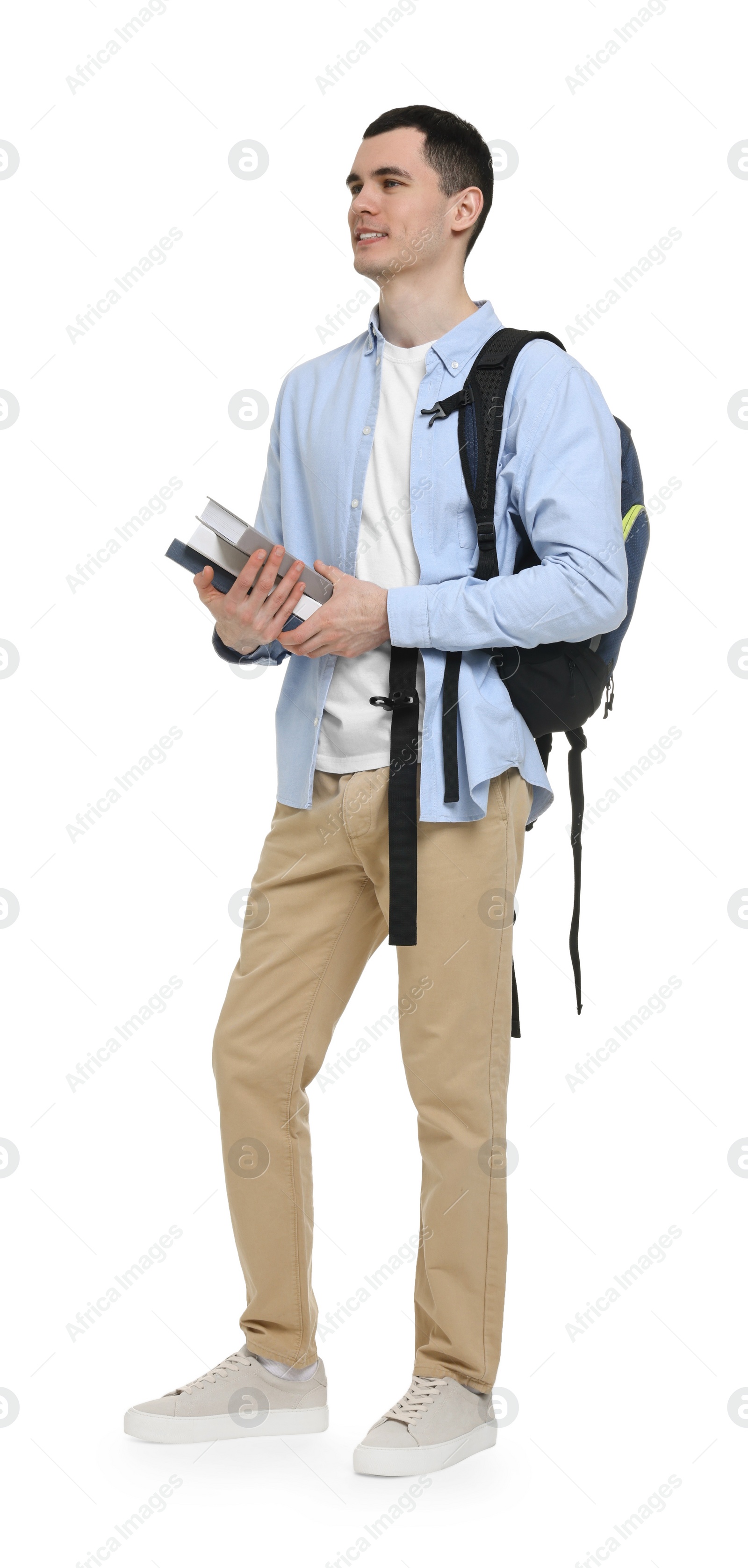 Photo of Young man with backpack and books on white background