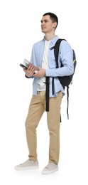 Young man with backpack and books on white background