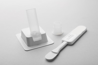 Photo of Disposable express test kit on light grey background