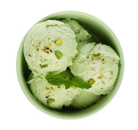 Photo of Bowl of delicious pistachio ice cream with mint on white background, top view