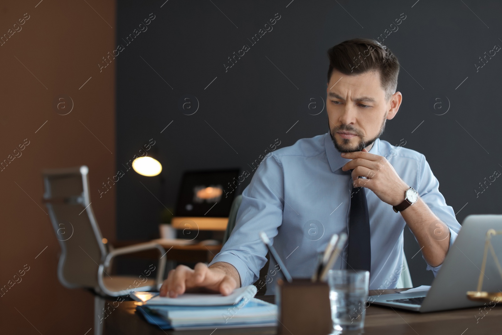 Photo of Male lawyer working in office