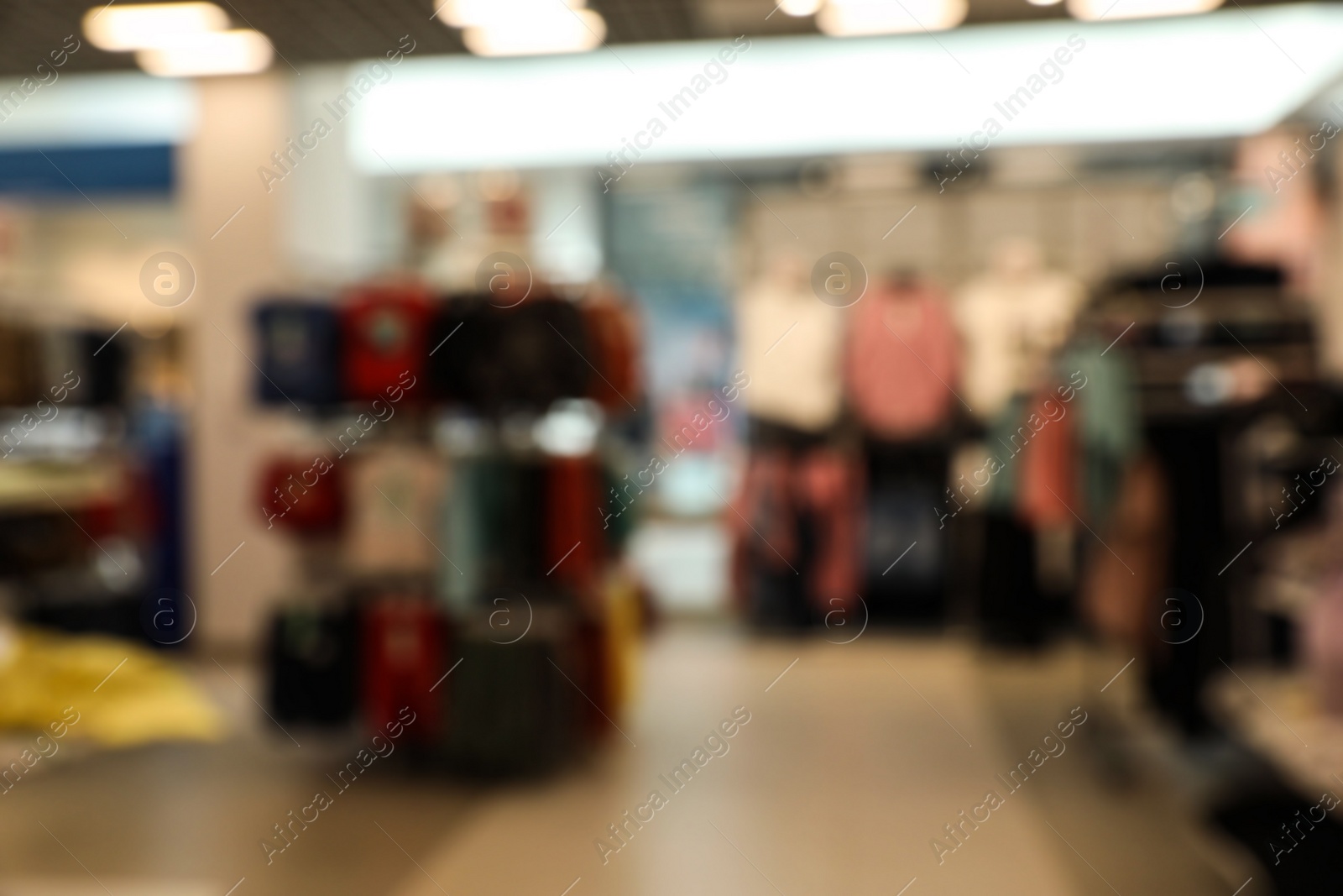 Photo of Blurred view of store interior in shopping mall. Bokeh effect