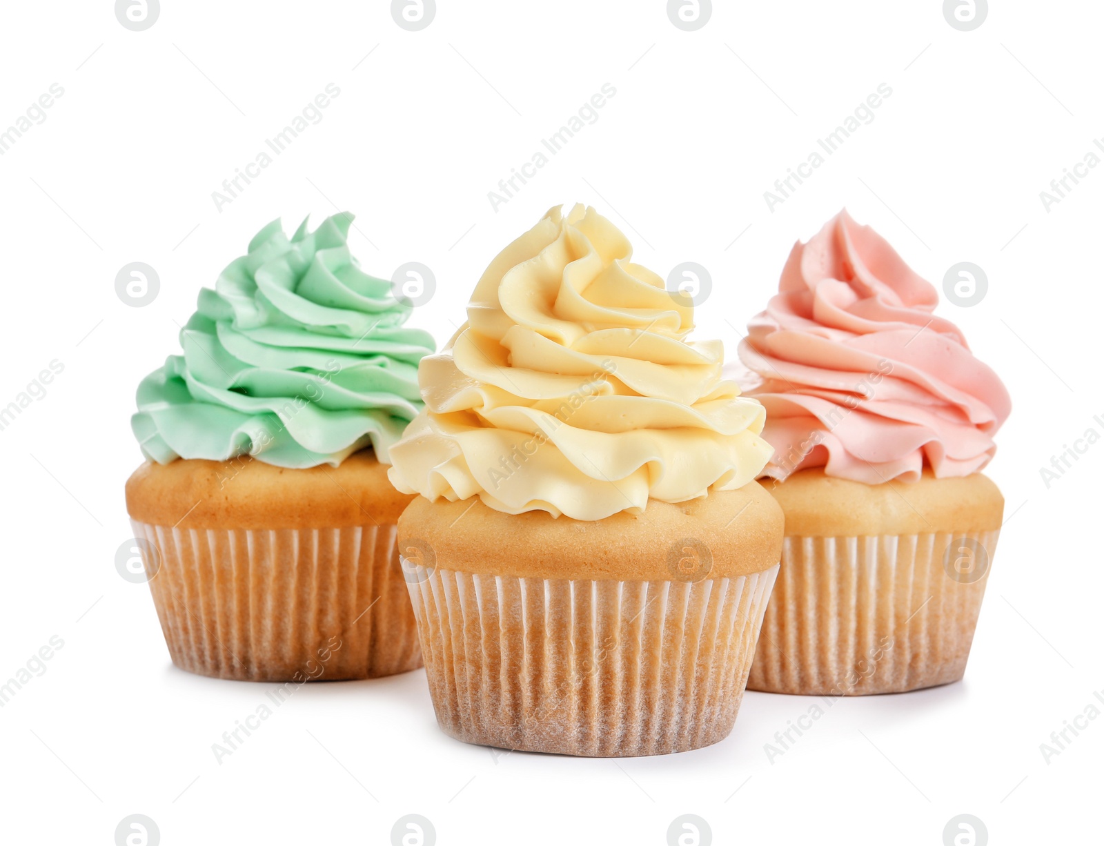 Photo of Delicious cupcakes with cream on white background