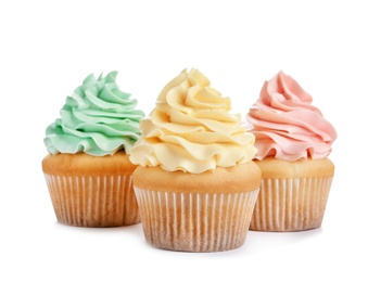 Delicious cupcakes with cream on white background