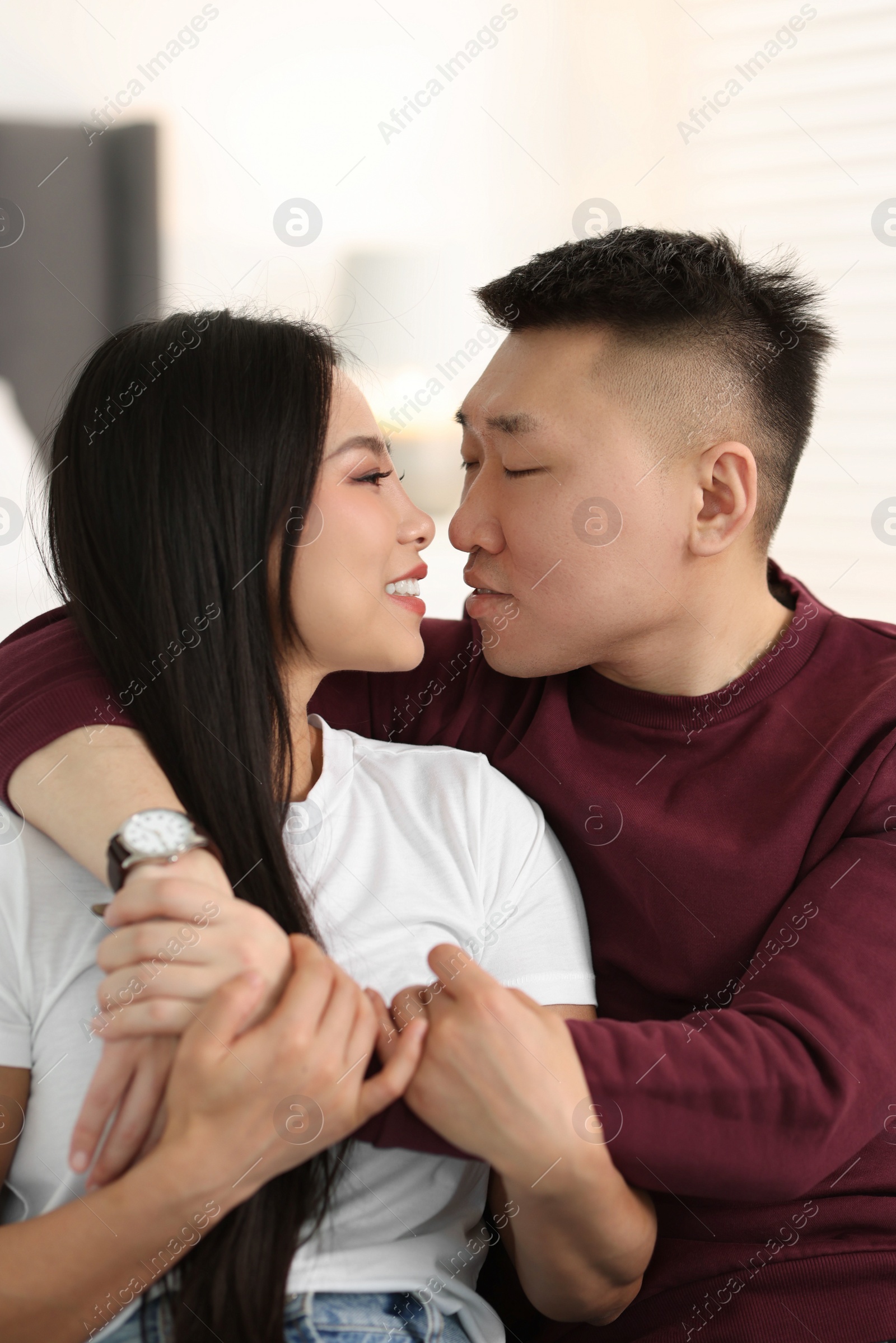 Photo of Portrait of lovely young couple at home