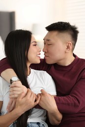 Photo of Portrait of lovely young couple at home