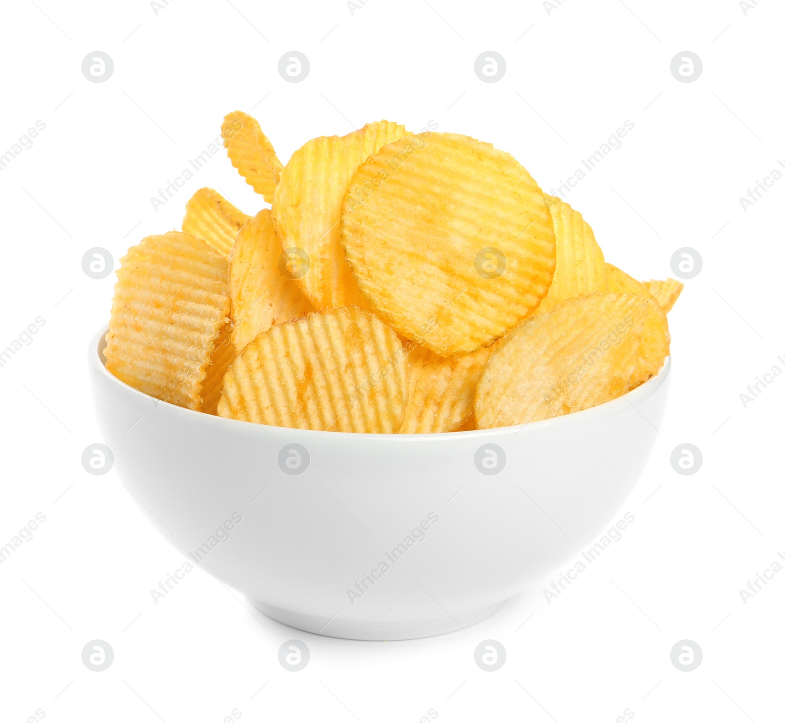 Photo of Bowl of tasty ridged potato chips on white background