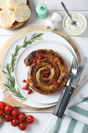 Photo of Tasty homemade sausages served on white wooden table, flat lay