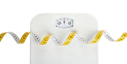 Measuring tape and scales on white background, top view. Concept of weight loss