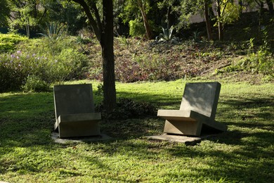 Photo of Beautiful stone benches in park on sunny day