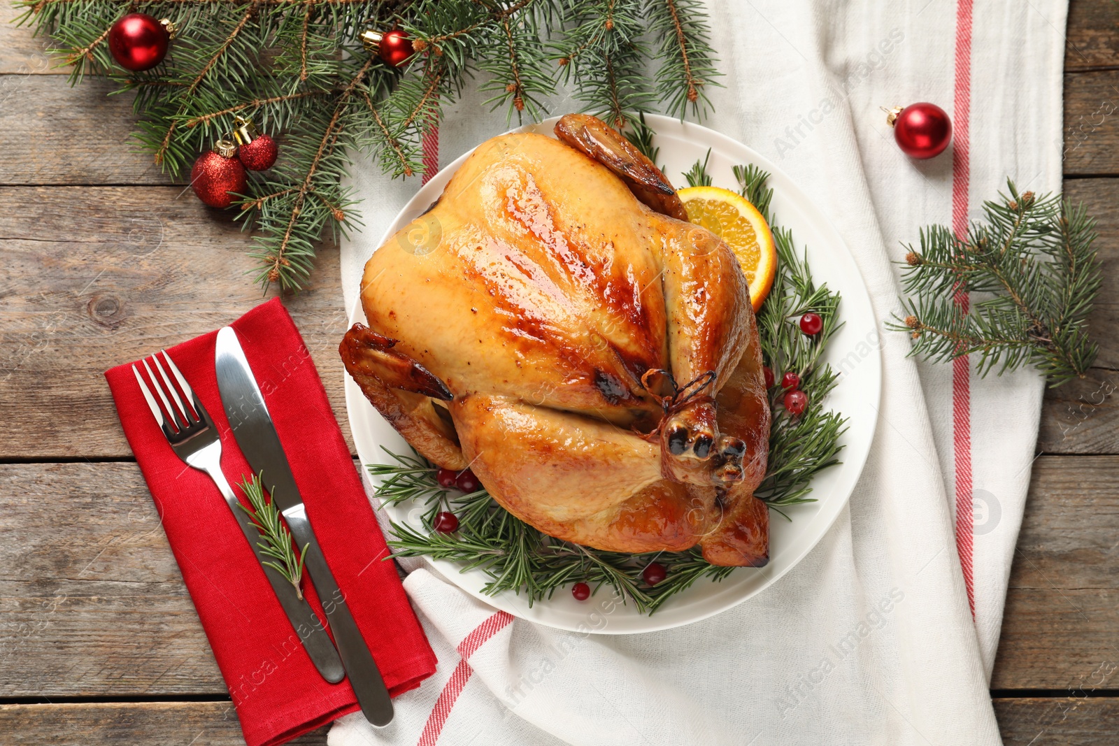 Photo of Cooked turkey with garnish served for Christmas dinner on table, flat lay