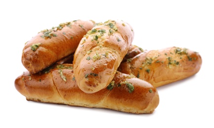 Photo of Bread loaves with garlic and herbs on white background