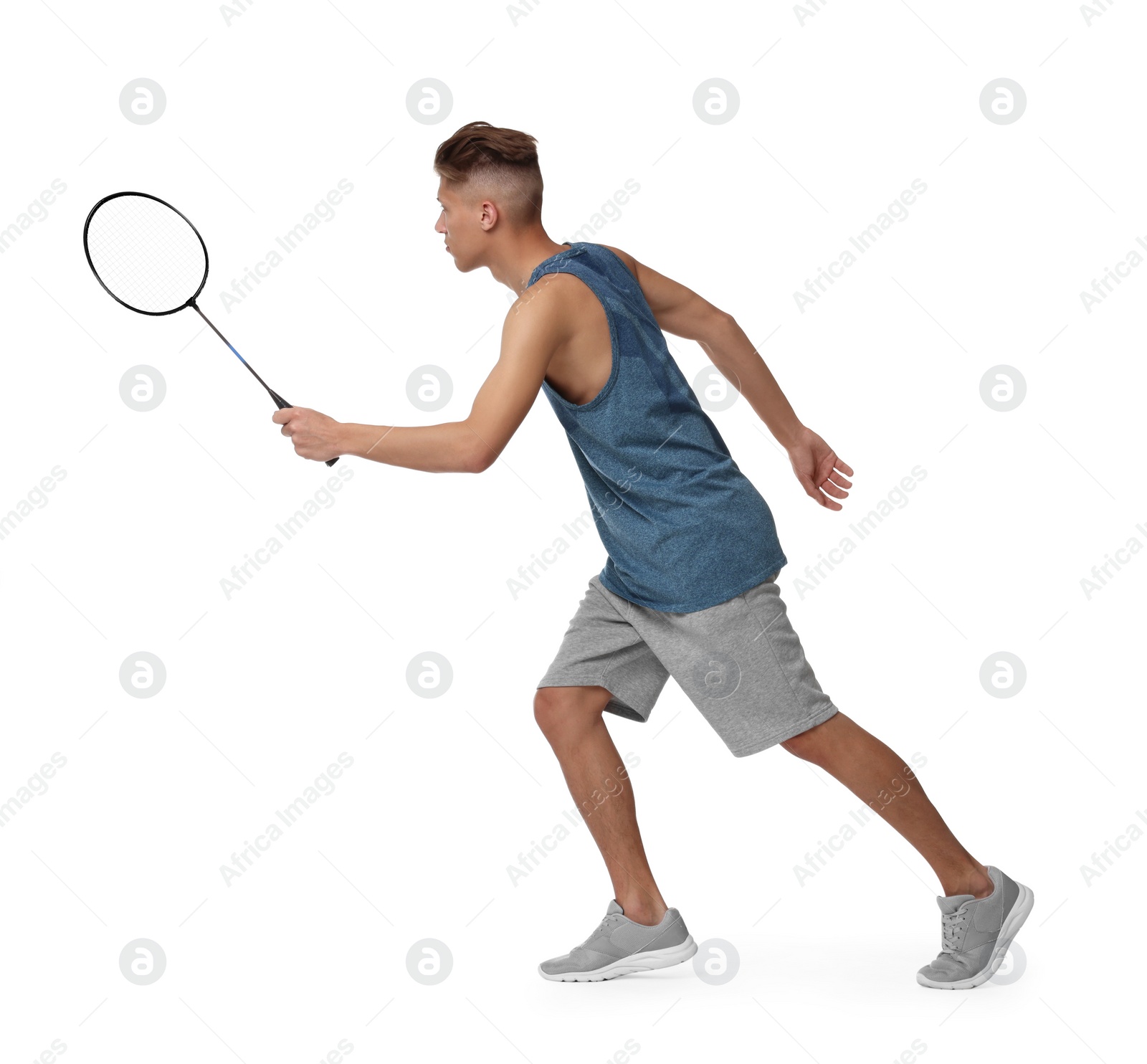 Photo of Young man playing badminton with racket on white background