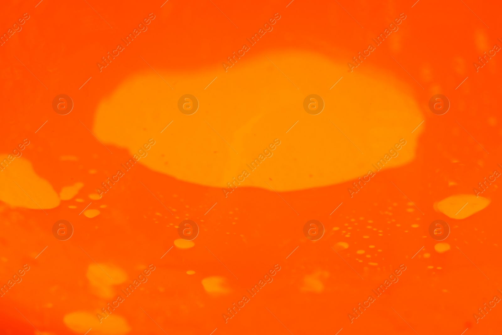 Photo of Delicious orange jelly as background, closeup view