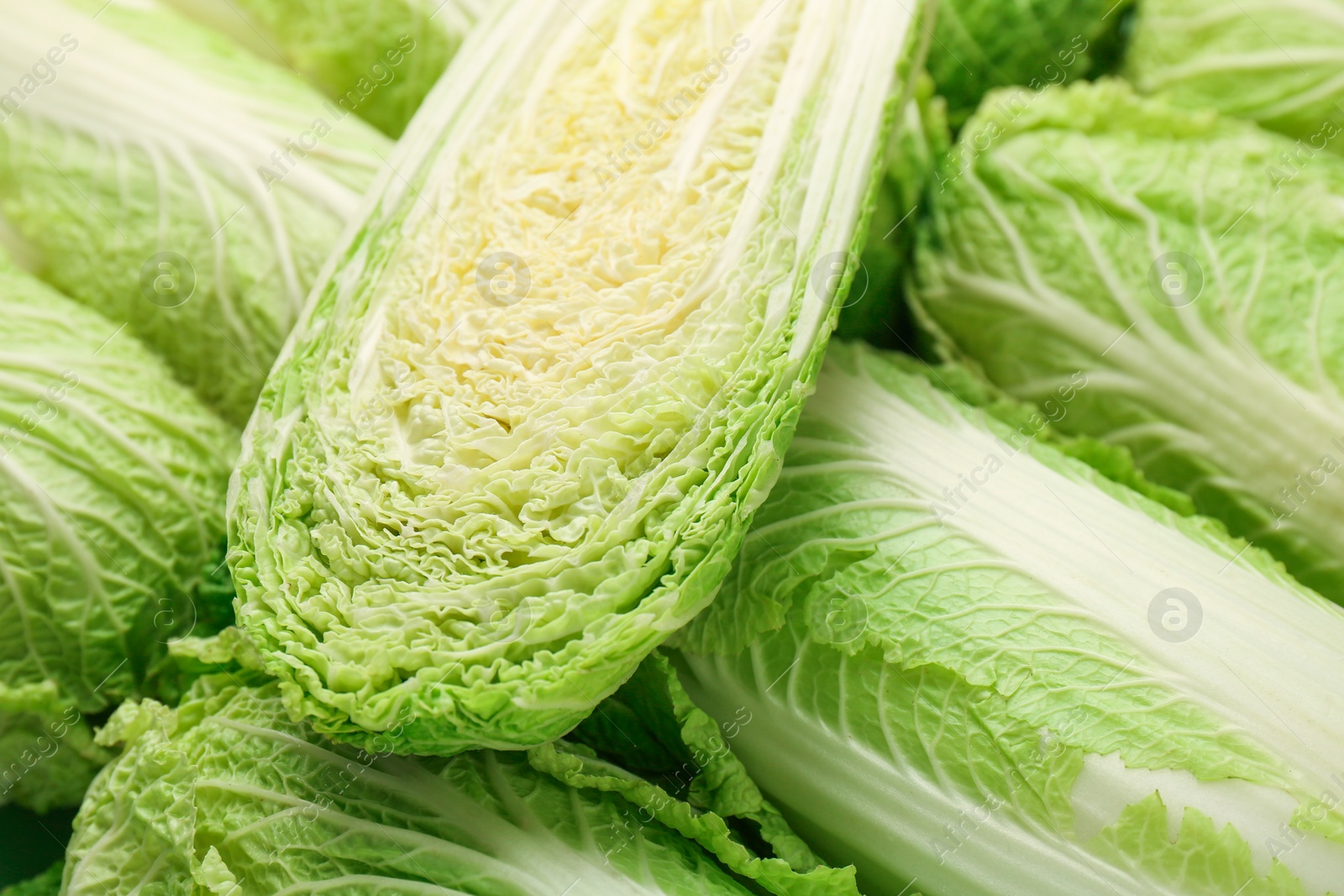 Photo of Fresh ripe Chinese cabbages as background, closeup