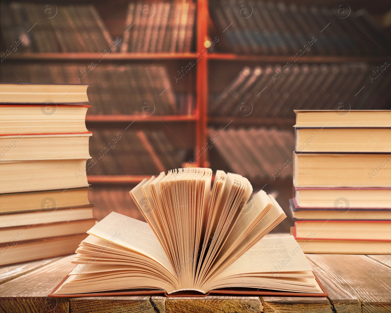 Image of Different books on wooden table in library