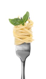 Photo of Fork with tasty pasta and basil isolated on white